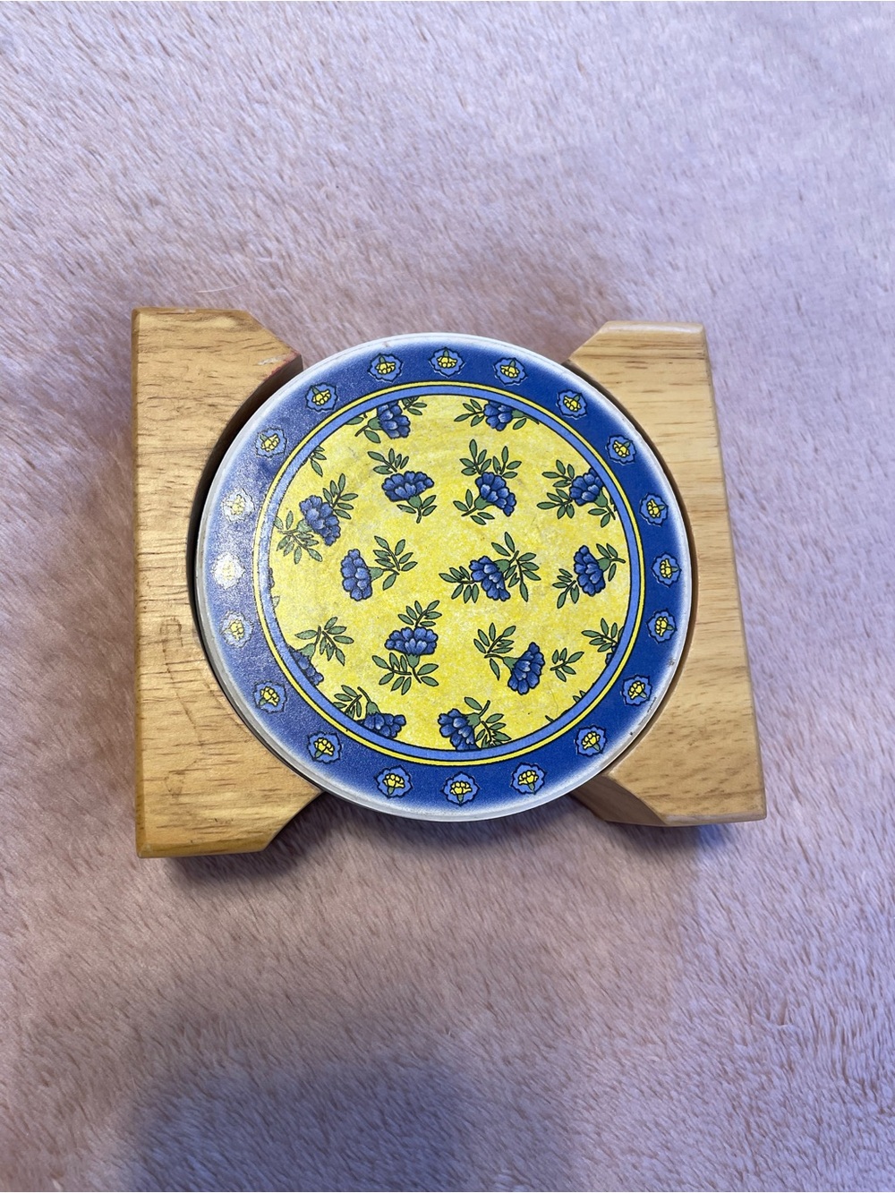 Set of coasters with yellow and blue floral designs